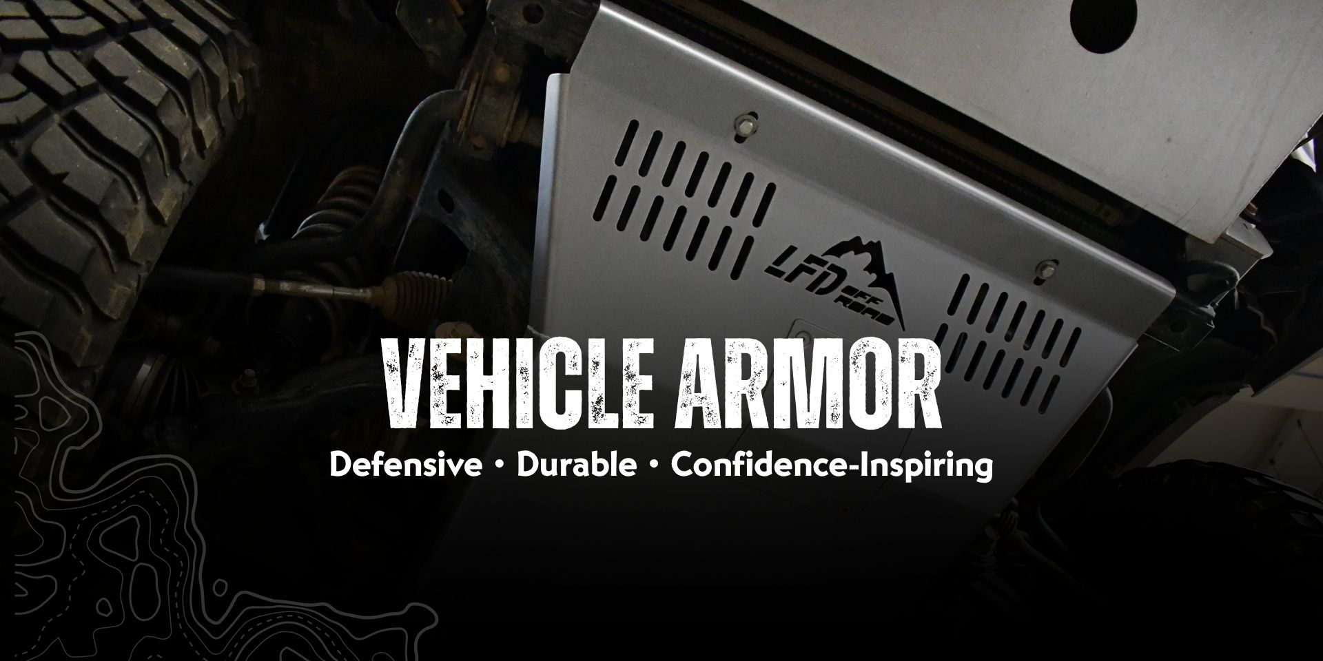 Close-up of LFD skid plate mounted on the underside of a vehicle, with text "Vehicle Armor - defensive, durable, confidence-inspiring"