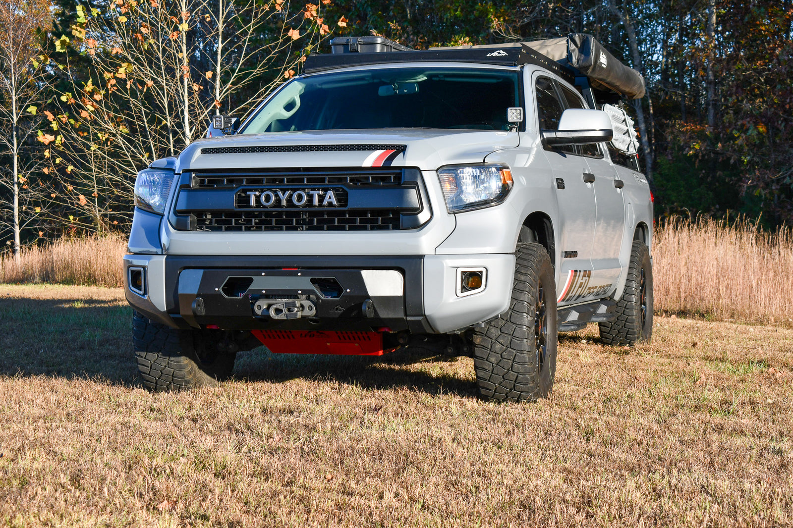 Front bumper for 2nd Gen Tundra displayed on a Toyota Tundra truck, showing the bumper's mounting points and winch capability.