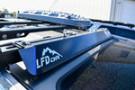 A blue bolt on wind fairing mounted on a vehicle roof rack, with the LFD logo visible.