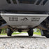 A front skid plate on a 5th Gen 4Runner, constructed of metal and featuring a Welded backing plate with countersunk holes for bolts, positioned under the vehicle's front bumper.