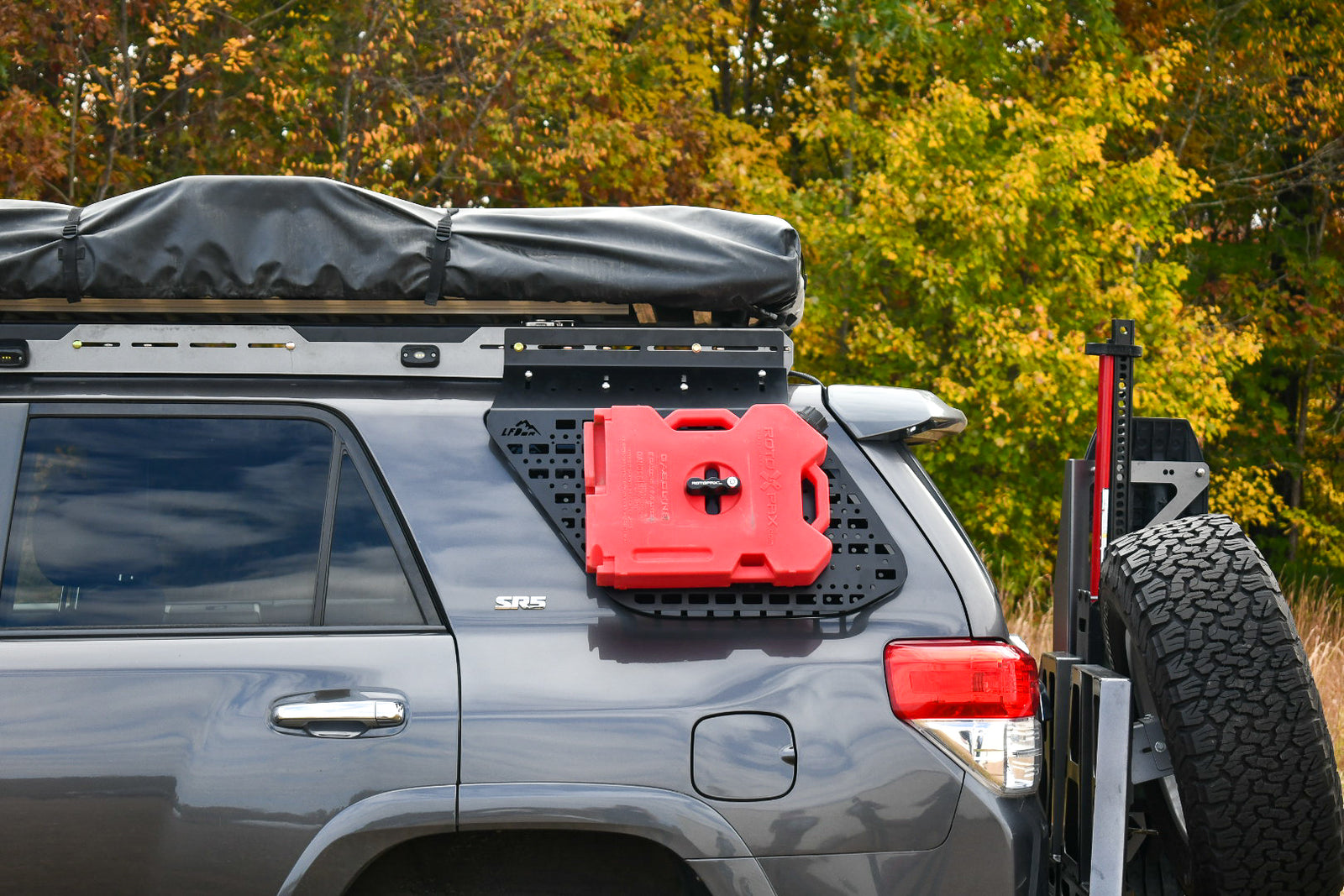 A gray 5th Gen 4Runner with Multi Purpose Window Panels mounted on the rear windows, featuring holes for mounting equipment.