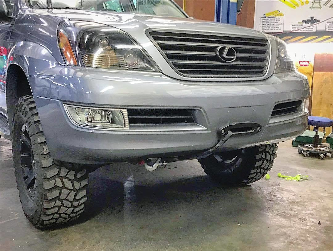 Front view of a GX470 Lexus SUV with an adjustable hidden winch mount installed on the front bumper.