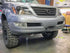 Front view of a GX470 Lexus SUV with an adjustable hidden winch mount installed on the front bumper.